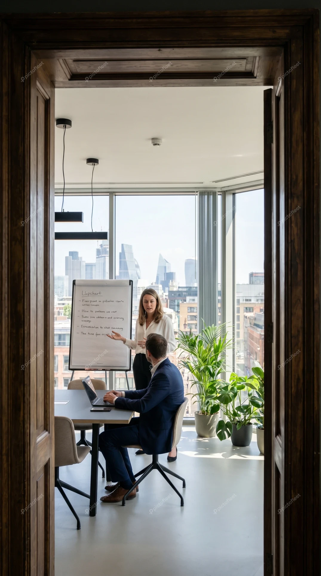 Businesswoman giving presentation in modern high-rise office