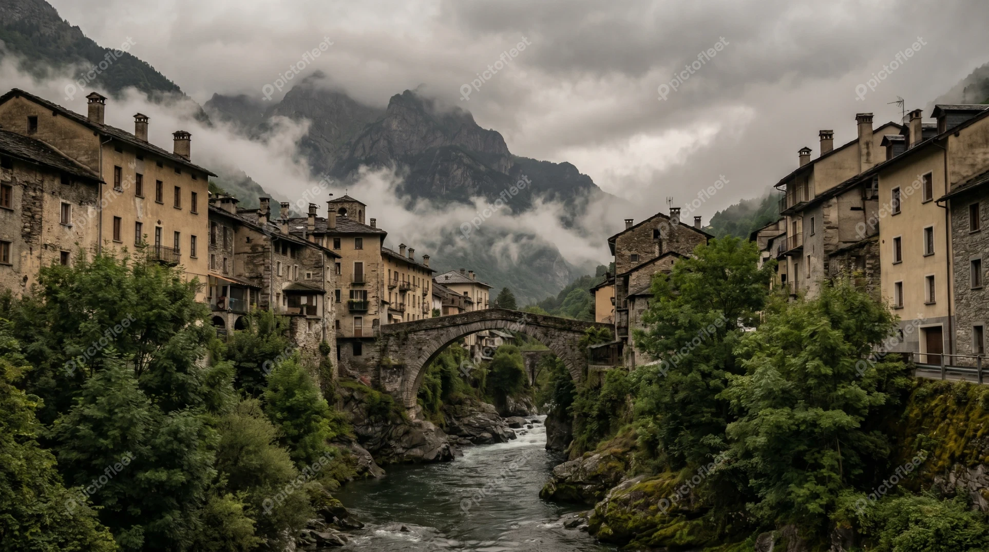 Historical stone village with bridge over mountain river