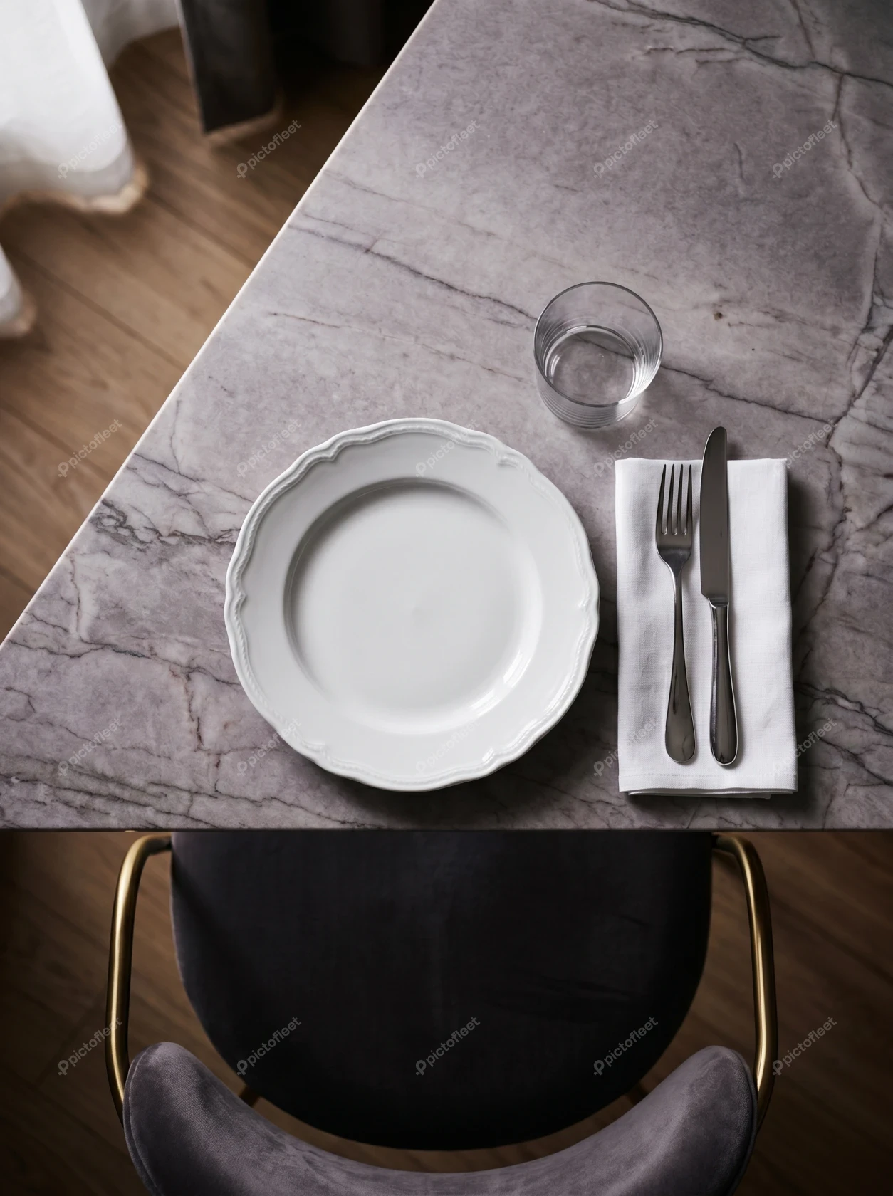 Elegant table setting with white plate on marble table